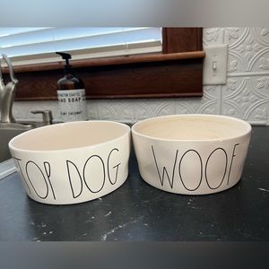 Two large Rae Dunn dog bowls